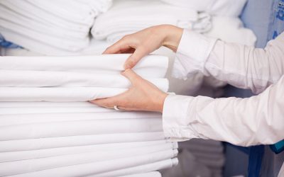01-folded-white-sheets-laundry-room